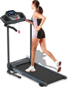 SereneLife Folding Treadmill with a woman jogging on it, showcasing its compact design and user-friendly interface.